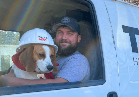 Rochester HVAC Technician Holding Dog